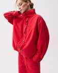 Liberty Funnel Neck Jacket by Pistola in Negroni red, button front detail