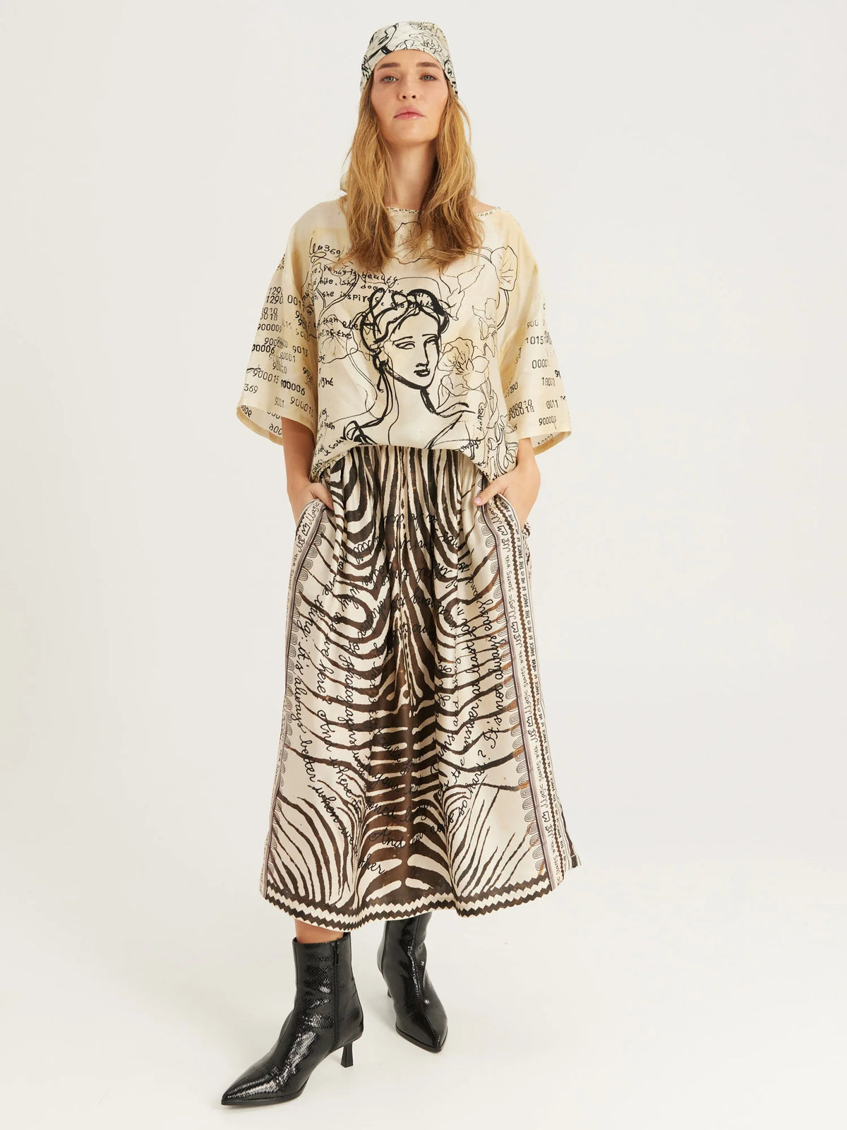 Vanessa Noir Midi Skirt by ME369 in black and white zebra and script print, side view